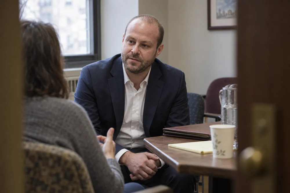 Joshua Butnick counseling a client during a business dispute mediation